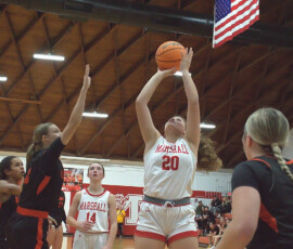 McKenzie Davis (20) goes up inside for Marshall against Altamont.