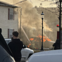 Marshall firefighters work to contain a fire Wednesday afternoon as high winds contributed to its spread. Photos submitted by Bobbye Scott.